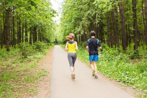 Running together - friends jogging in park