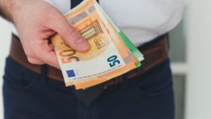 Detail of man hands with money, euro notes