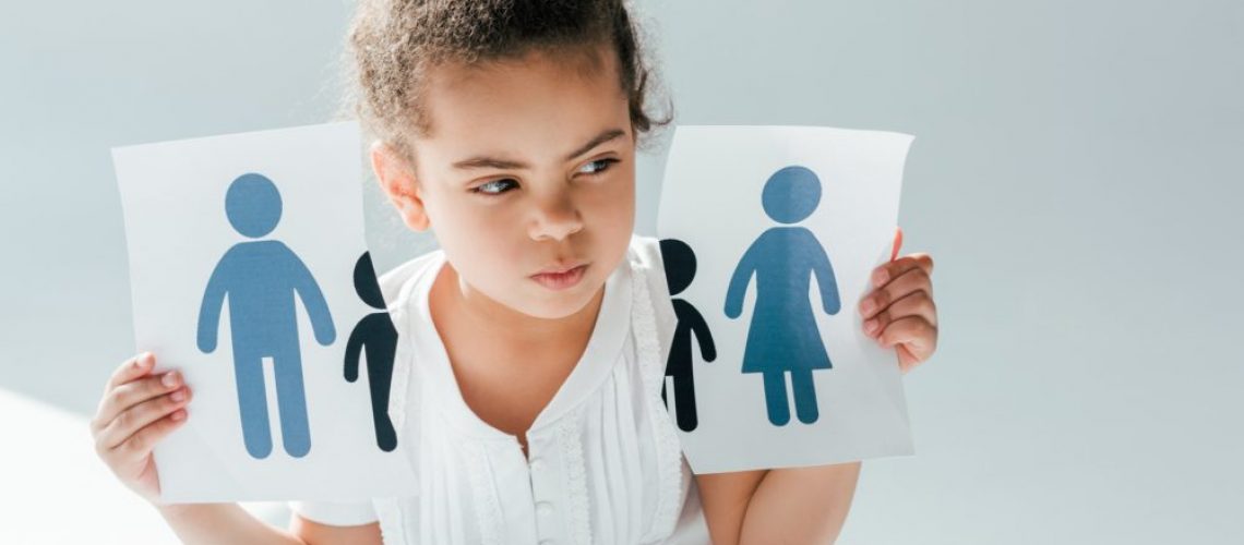 african american kid holding ripped paper with family on white, divorce concept