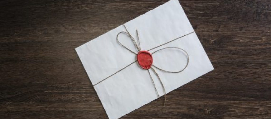 Letter with seal on table